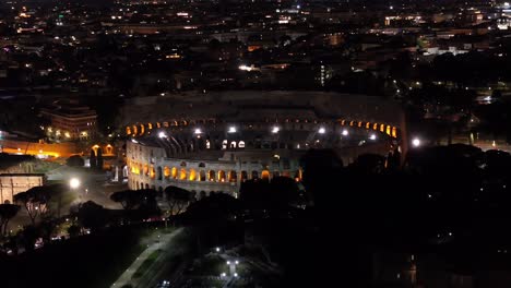 Drone-View-of-Roman-Colosseum-at-Night-in-Rome,-Italy