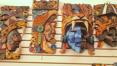 Carved-Wooden-Art-With-Mayan-Gods-in-Souvenir-Shop-in-Chichen-Itza-Temple-Complex,-Mexico