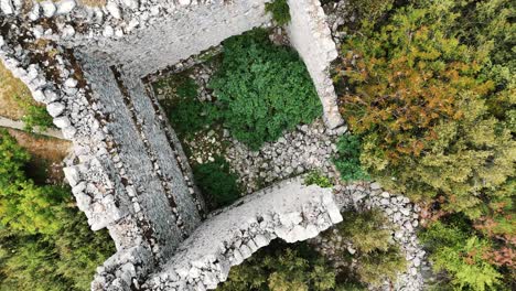 Aerial-View-of-the-Ruins-of-the-Ancient-Roman-Kadrema-Castle-Located-in-the-Gedelme-Village-and-Mountain-Ridge-on-Background