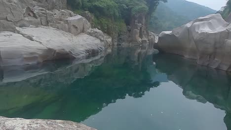 naturally-formed-white-shiny-stone-in-unique-shape-at-mountain-river-bed-at-morning-video-is-taken-at-Sliang-wah-Umngot-amkoi-jaintia-hill-meghalaya-india