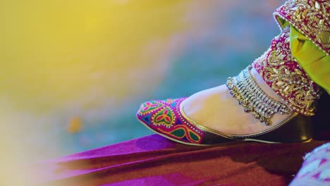 A-beautiful-close-up-of-foot-of-an-Indian-bride-during-photo-shoot-having-anklet