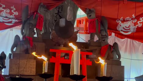 Candles-in-a-shrine-at-Fushimi-Inari-Taisha-in-Japan