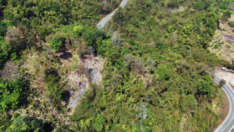 Road,-jungle-and-mountain-in-Songklaburi,-Thailand