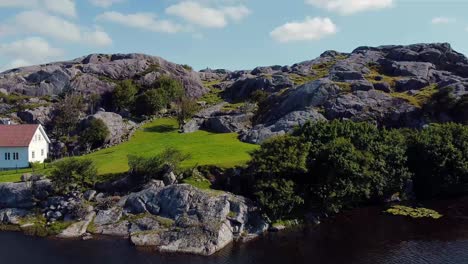 Idyllic-landscape-of-lake,-forest,-and-mountains,-Norway---Top-view