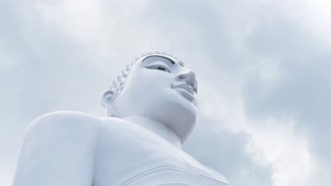 Slow-motion-SLR-landscape-view-of-large-Buddha-face-concrete-statue-religion-spiritual-sacred-temple-culture-retreat-meditation-Kandy-Sri-Lanka-travel-tourism