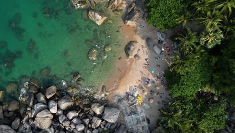 Overhead-aerial-view-of-beautiful-tropical-beach-with-people