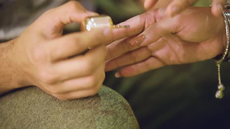 The-bride's-stunning-nails-are-given-a-second-layer-of-glitter-by-the-stylist