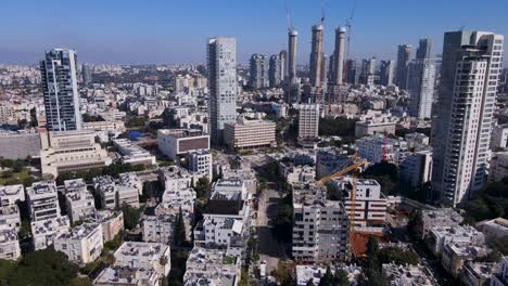 Aerial-view-of-a-dense-urban-cityscape-with-skyscrapers-and-construction