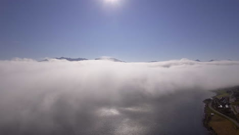 Aerial-of-clouds-drifting-over-a-fjord