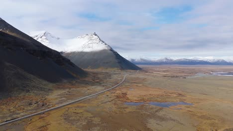 Aerial-Panoramic-of-Iceland-Natural-Glacial-River-Mountains-Snowy-Geological-Formations,-skyline-background,-icelandic-travel-spot