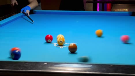 Breaking-at-a-game-of-9-ball-of-billiard