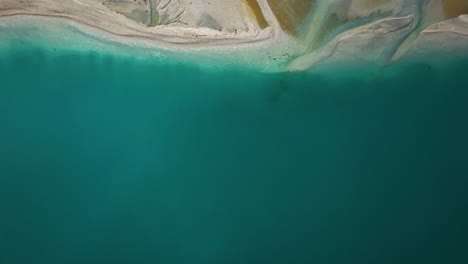 Drone-top-down-overview-of-glacial-floodplain-delta-of-Glenorchy-with-yellow-deposits