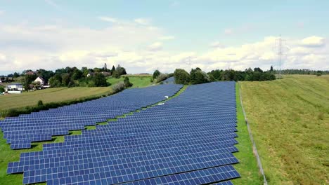 Flyover-photovoltaic-field-surrounded-by-farmland