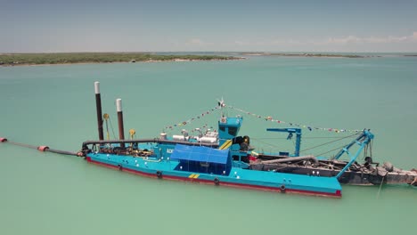 Sand-dredging-boat-in-full-operation-in-Matamoros,-on-the-Gulf-of-Mexico