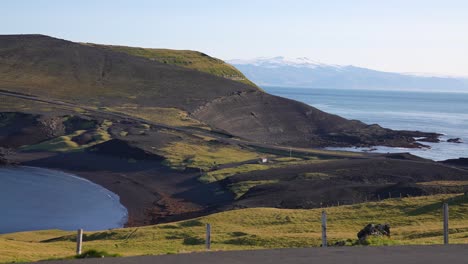 Scenic-Coastline-and-Green-Pastures-of-Heimaey,-Westman-Islands,-Iceland-on-Sunny-Summer-Day