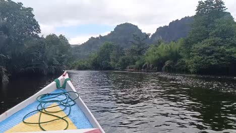 The-boat-sails-on-the-river-through-the-forest-in-Ramang-Ramang-village,-Maros