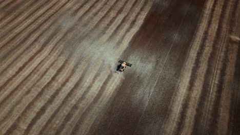 Overhead-a-Combine-Harvests-a-Large-Brown-Crop-During-a-Dry-Summer-Drought