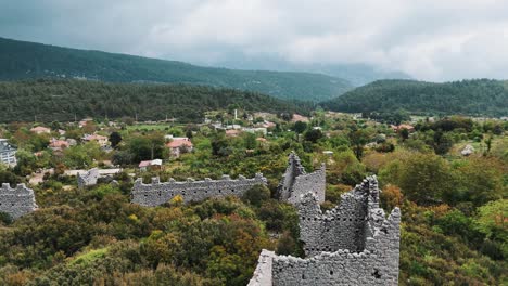 Aerial-View-of-the-Ruins-of-the-Ancient-Roman-Kadrema-Castle-Located-in-the-Gedelme-Village-and-Mountain-Ridge-on-Background