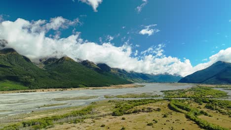 Vibrant-bright-cheerful-day-above-Glenorchy-glacial-fed-river-floodplains-and-mountain