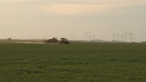 Tractor-spraying-wheat-crops-against-fungal-plant-disease