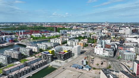 Aerial-tracking-shot-of-the-cityscape-of-Jatkasaari,-sunny,-summer-day-in-Finland