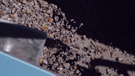 Close-up-of-granite-stones-on-a-separator-conveyor-belt