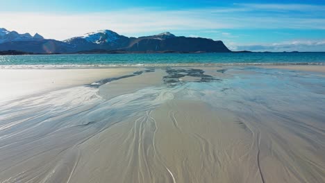 Walking-on-the-beach-towards-the-turquoise-sea-waters-on-a-sunny-spring-day