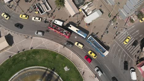 Aerial-perspective-on-a-roundabout-with-a-big-fountain-in-the-middle-in-the-city-center-of-Athens