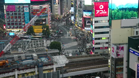 Shibuya-Pedestrian-Crossing-In-Tokyo,-Japan-At-Daytime---High-Angle-Shot