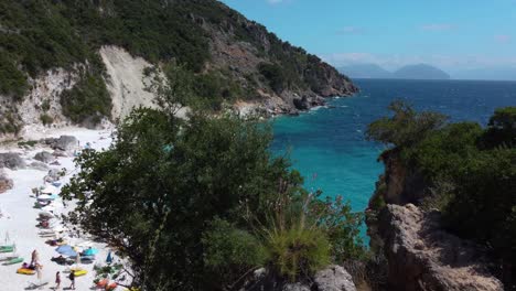 Aerial-Tilt-over-the-Cliffs-of-Agiofili-Beach,-Lefkada,-Greece