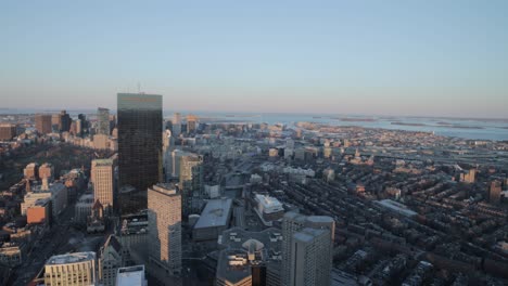 Boston-skyline-during-golden-hour-from-the-top-of-a-sky-scraper-viewing-deck-in-4k