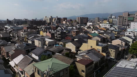 Houses-And-Buildings-In-Kyoto,-Japan---Aerial-Drone-Shot