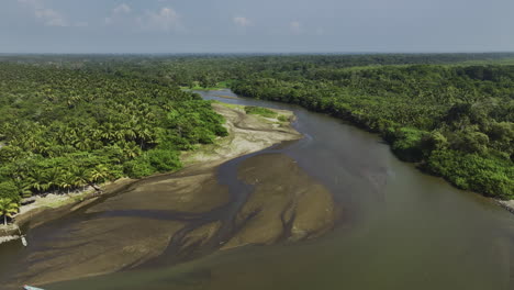 Drone-circling-a-shallow-river-between-unique-vegetation-of-Barra-San-Jose,-Mexico