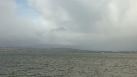 Hand-held-shot-of-the-Scottish-landscape-from-a-ferry-on-a-overcast-day