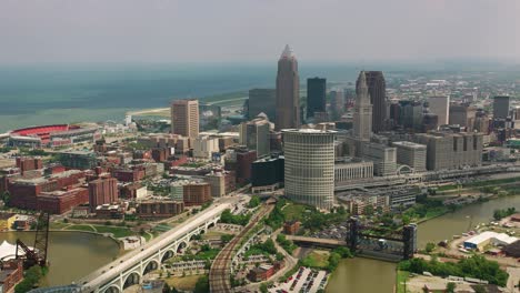 Aerial-View-of-Cleveland,-Ohio-Sunny-Day-Drone-Shot-of-Cuyahoga-River-and-Innerbelt-Bridge-in-4K