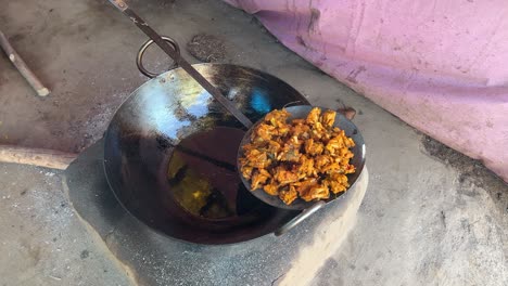 Pakora-being-fried-in-hot-oil-in-local-Dhaba-in-Bihari-Style-in-earthen-traditional-stove