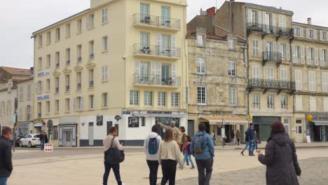 Pedestrians-Walking-On-Street-In-Old-Town-Of-La-Rochelle-In-France