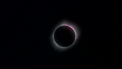 Zoom-in-on-solar-eclipse-showing-prominences,-corona-and-diamond-ring-effect
