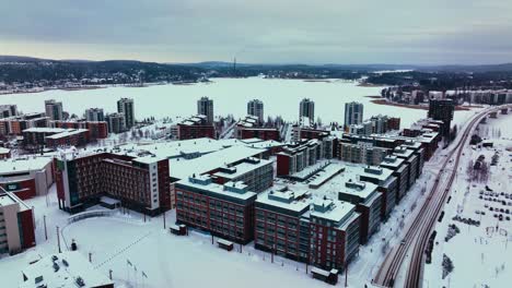 Aerial-overview-of-the-Lutakko-district-of-Jyvaskyla,-winter-evening-in-Finland