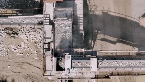 aerial-Top-down-view-of-stones-on-conveyor-belt-machinery-in-a-quarry