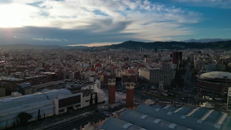 Barcelona-skyline-with-mountains-in-the-background,-shot-during-daylight,-aerial-view