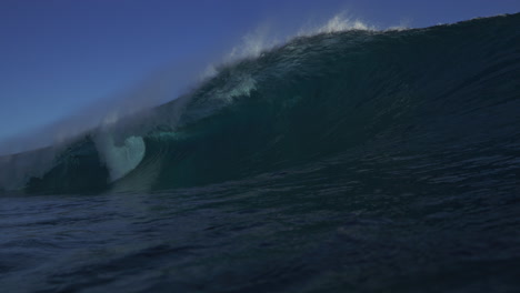 View-from-ocean-water-surface-as-heavy-wave-breaks-into-strong-barrel