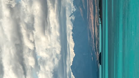 Vertical-timelapse-of-clouds-moving-over-mountain,-Lake-Pukaki,-New-Zealand