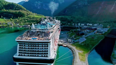 MSC-luxury-cruise-ship-docked-at-pier-in-Flam-Norway-fjord-port-Aerial-View