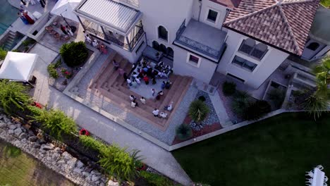 Bird's-eye-view-of-an-outdoor-wedding-reception-at-a-villa