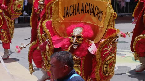 Fraternal-group-Jacha-Achachis-in-lavish-red,-gold-costume-in-Carnival