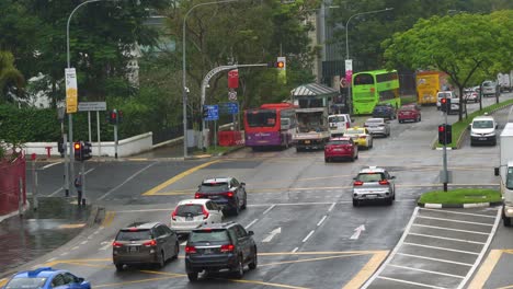 Daily-commuting-traffics-on-New-Bridge-Road-and-Eu-Tong-Sen-Street-at-downtown-Singapore-on-a-rainy-day