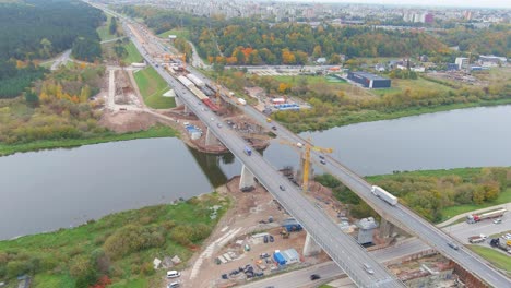 Panoramic-view-of-Kaunas-city-and-A1-highway-bridge-construction-site-in-autumn-season