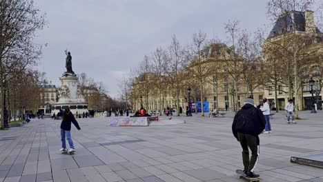 Daytime-view-of-Place-de-la-République-in-Paris-with-pedestrians,-wide-angle,-overcast-sky
