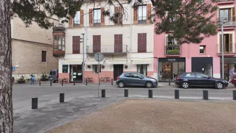 Plaza-Porta-Santa-Catalina-Palma,-Spain,-a-quiet-square-dedicated-to-art,-with-traditional-architecture-and-pedestrians